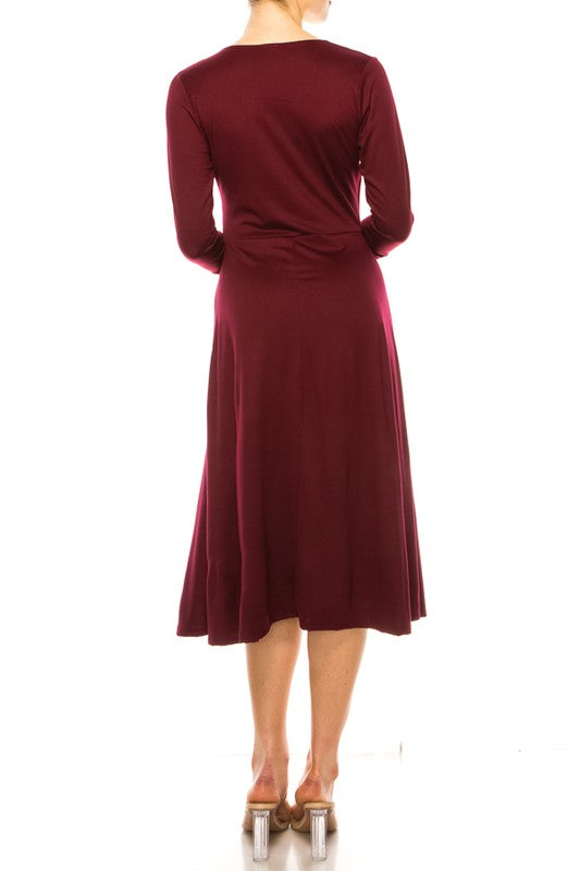 Solid faux wrap dress with deep V-neck